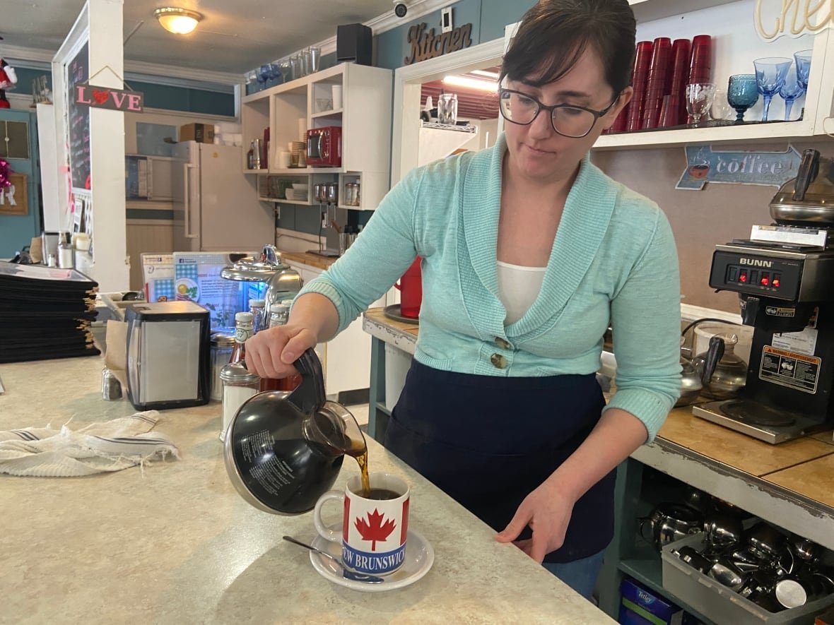 Jennifer MacMichael pouring coffee at a diner in St. Stephen, N.B.