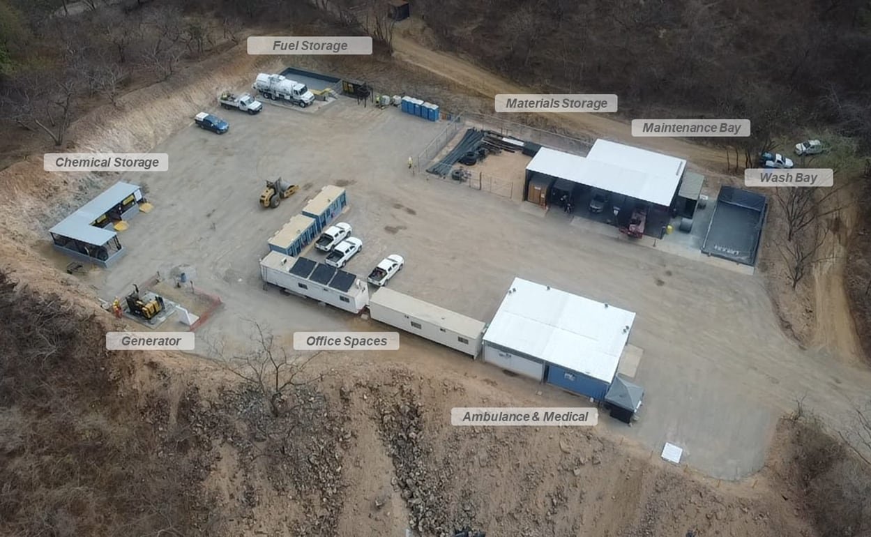 An aerial view of a compound with buildings.